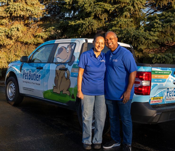 Pet Butler franchise owners, Yohann and Maria Connell standing in front of their new Pet Butler branded truck.