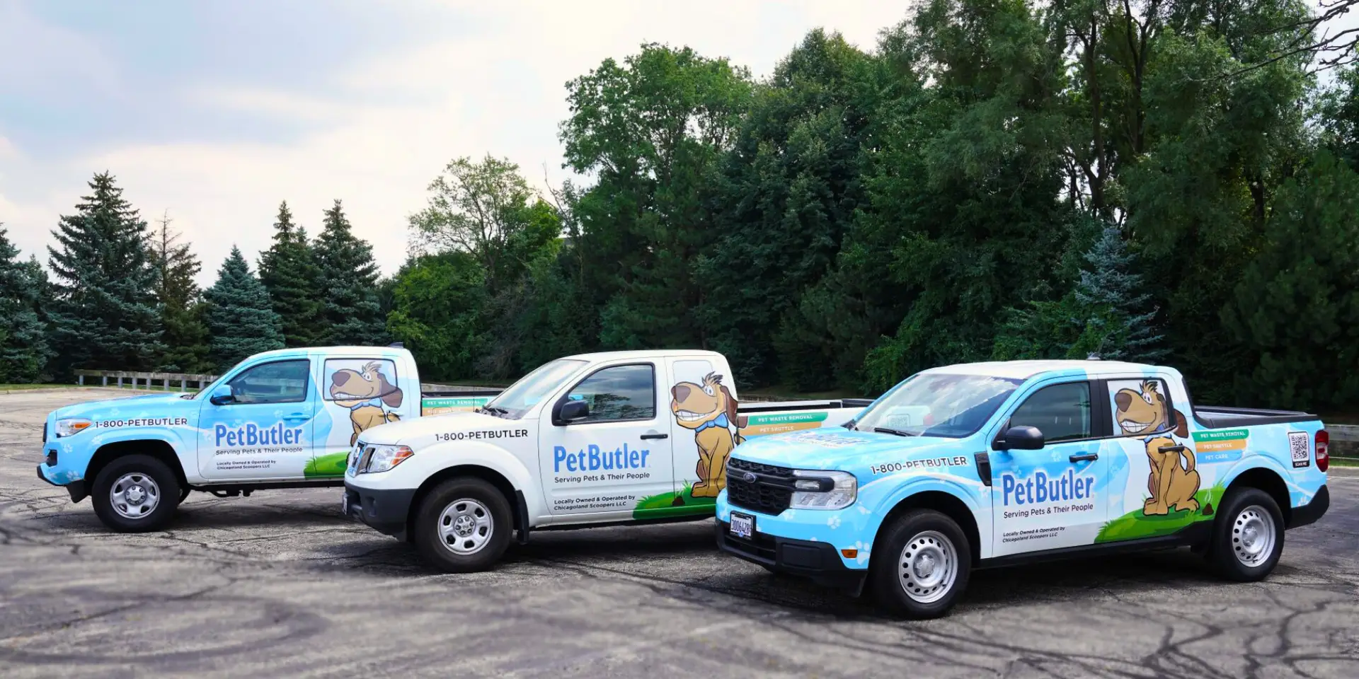 3 Pet Butler branded trucks lined up in a row