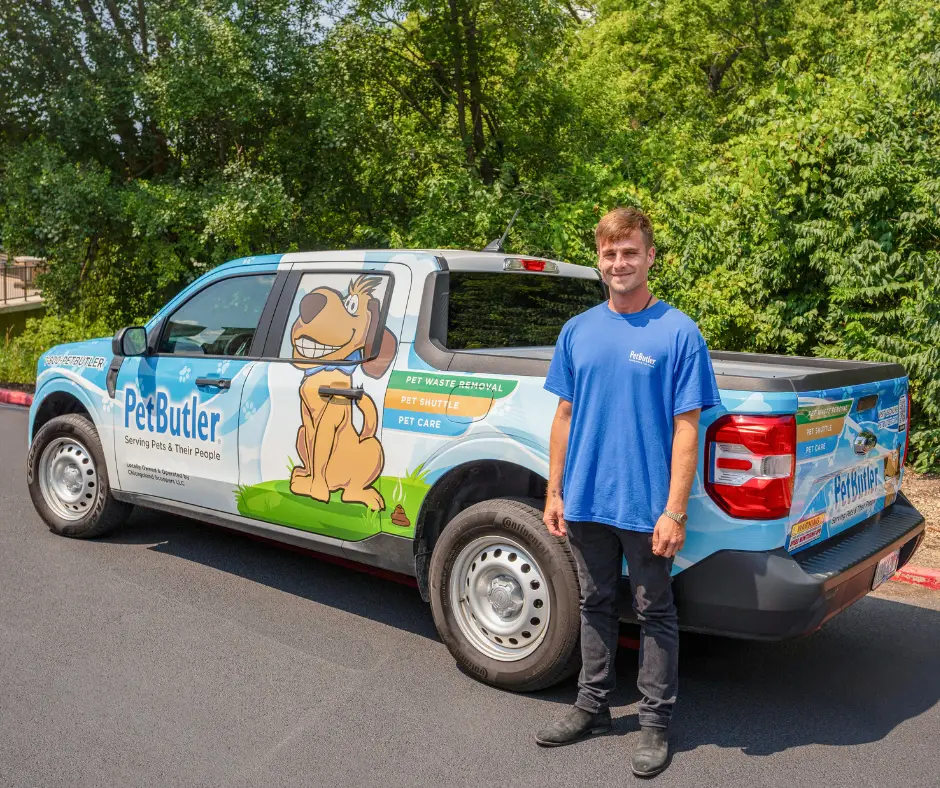Pet Butler franchise owner standing in front of Pet Butler truck