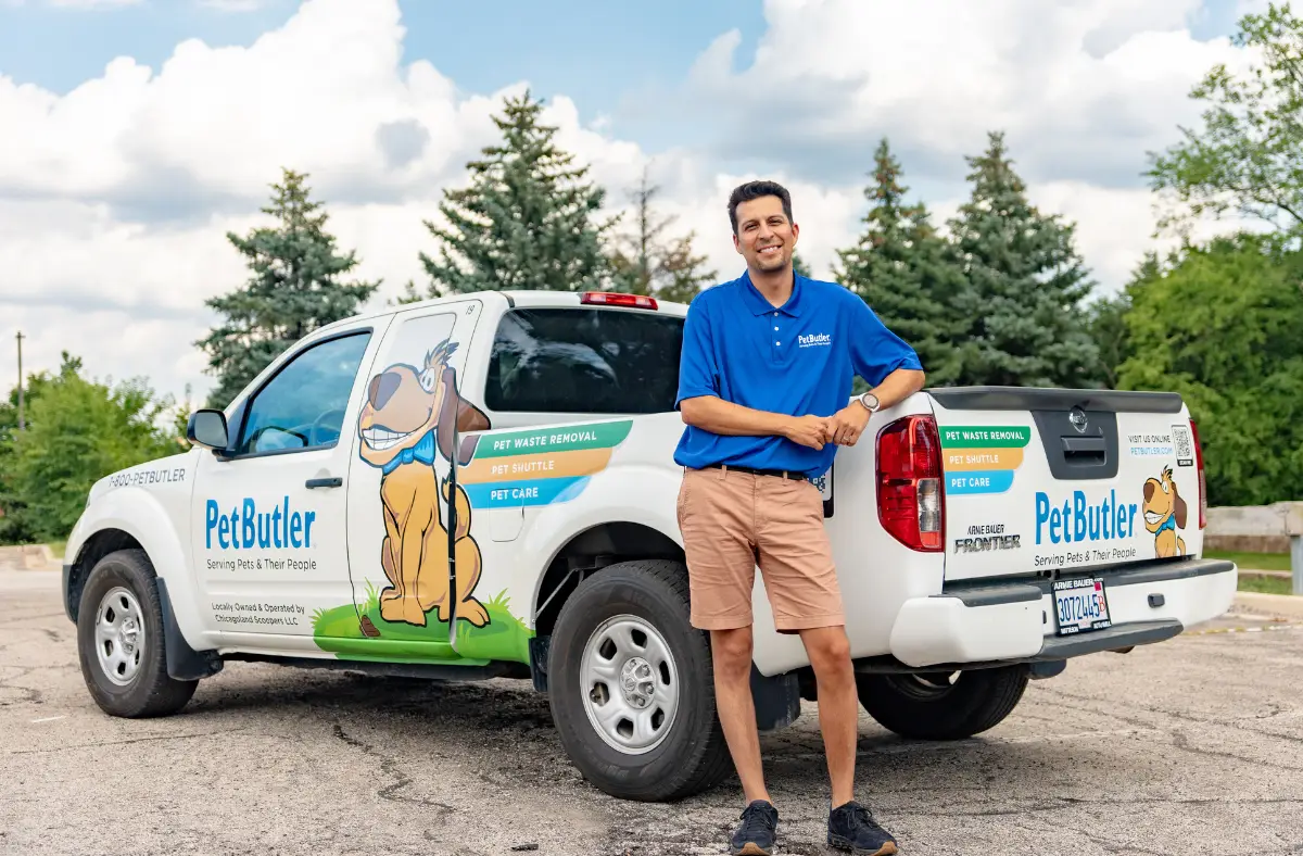 pet butler franchise owner standing and posing in front of pet butler truck