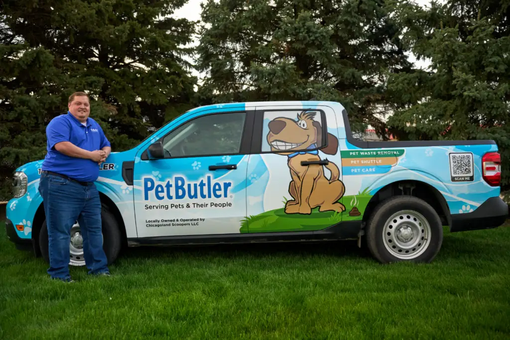 Pet Butler Franchise owner Rob Moore standing in front of Pet Butler truck.