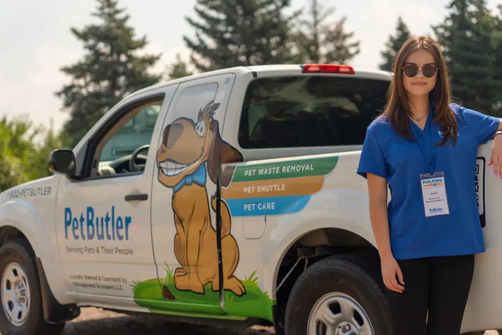 Pet Butler Franchise Owner standing in front of Pet Butler truck