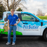 pet butler franchise owner, dana posing in front of pet butler truck